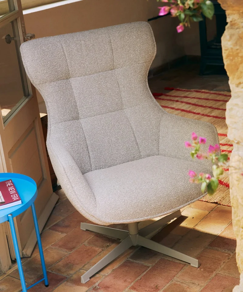 Sillón tapizado en tela bouclé Elsa