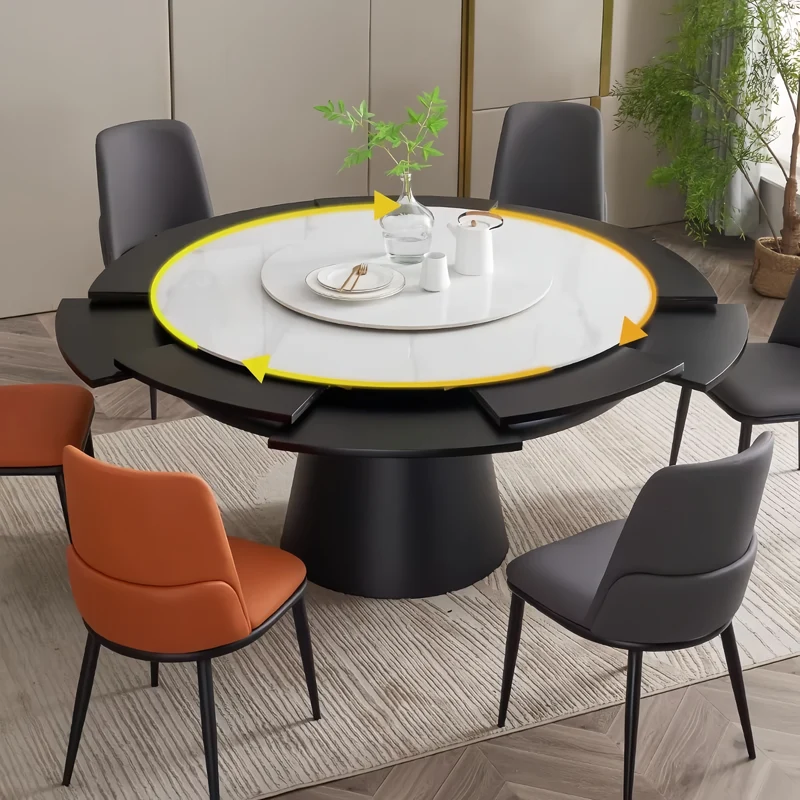 Table de salle à manger ronde avec plateau en pierre frittée et rallonge escamotable pivotante.