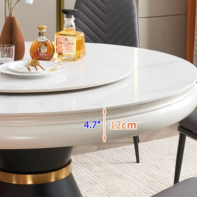 Table de salle à manger ronde avec plateau en pierre frittée et rallonge escamotable pivotante.