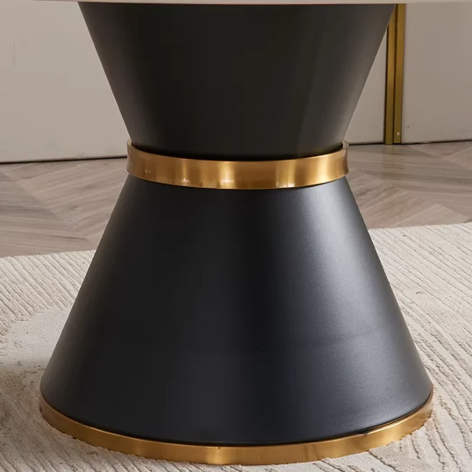 Table de salle à manger ronde avec plateau en pierre frittée et rallonge escamotable pivotante.