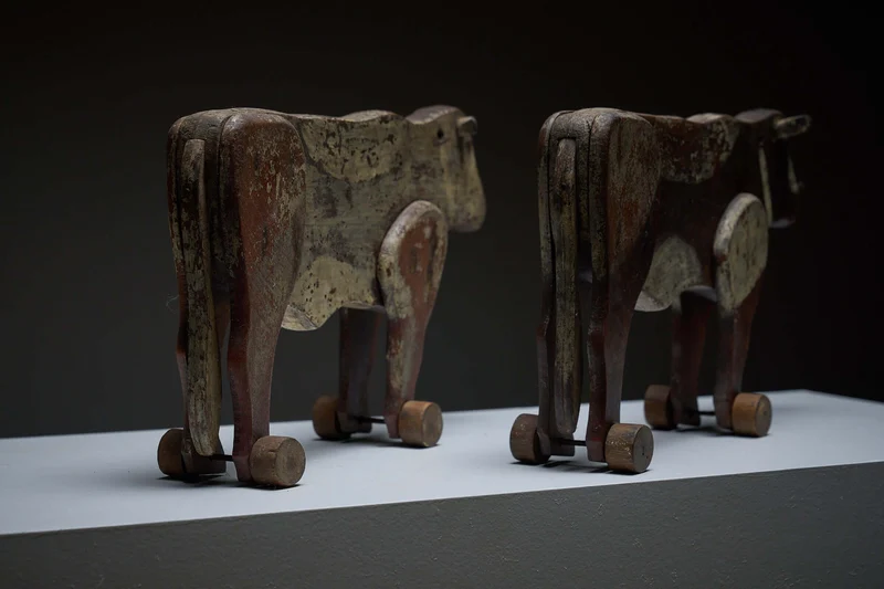 Pair of Antique Articulated Wooden Cow Pull Toys