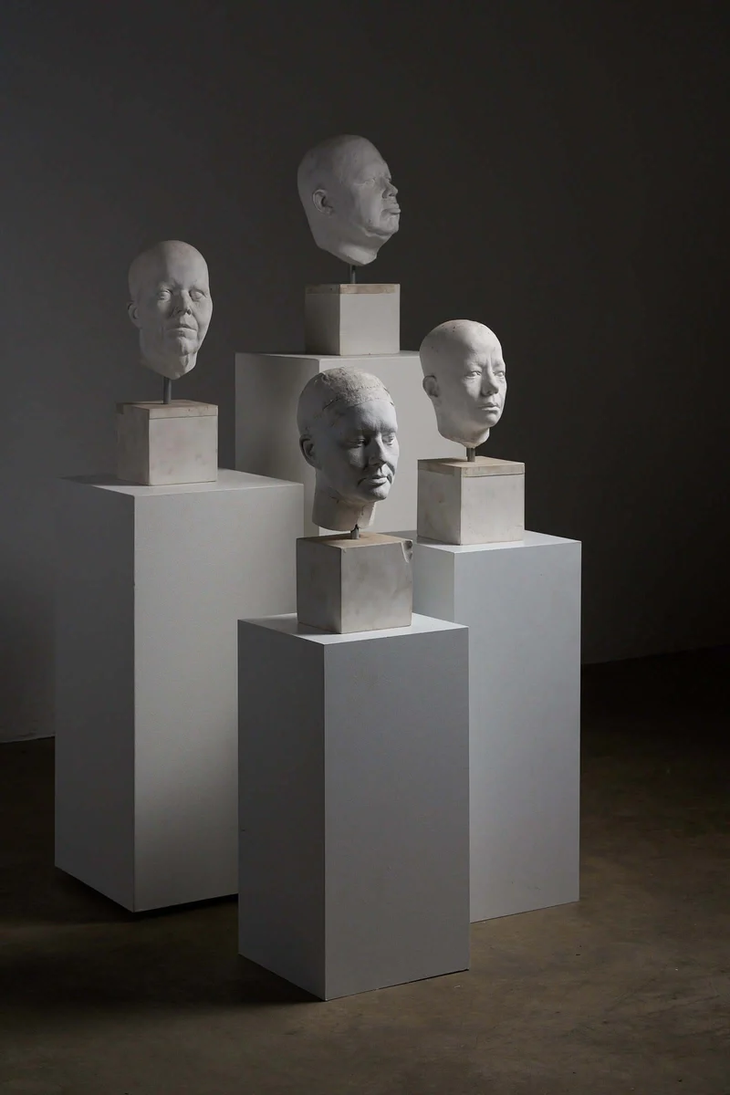 Set of Four Plaster Heads on Plinths