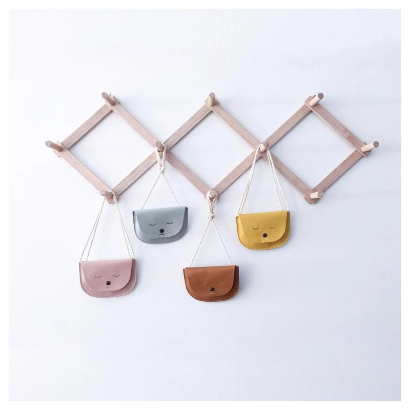 Cintre de porte-manteau accordéon en bois extensible
