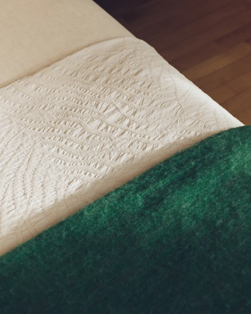 Odelna wool and acrylic throw with ruffles in green 130 x 170 cm