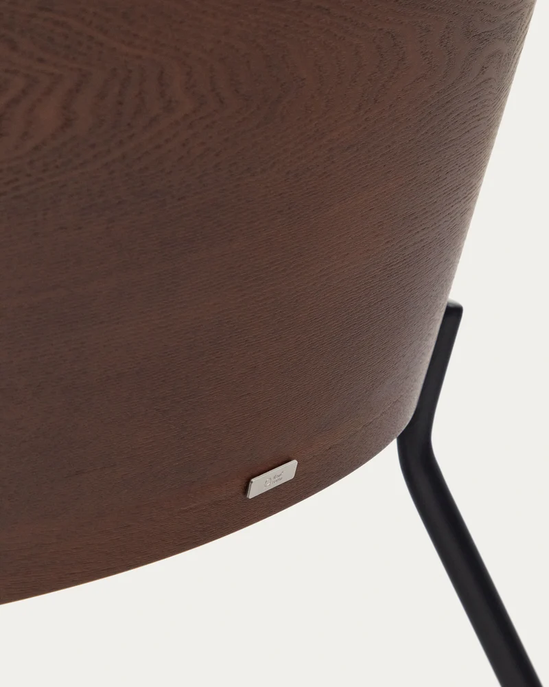 Eamy light brown armchair in an ash wood veneer with a walnut finish and black metal