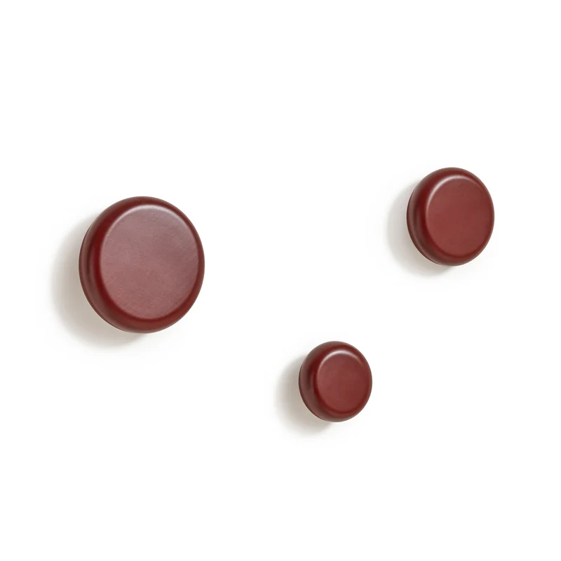Nadue set of 3 solid beech wood wall hooks with a maroon finish