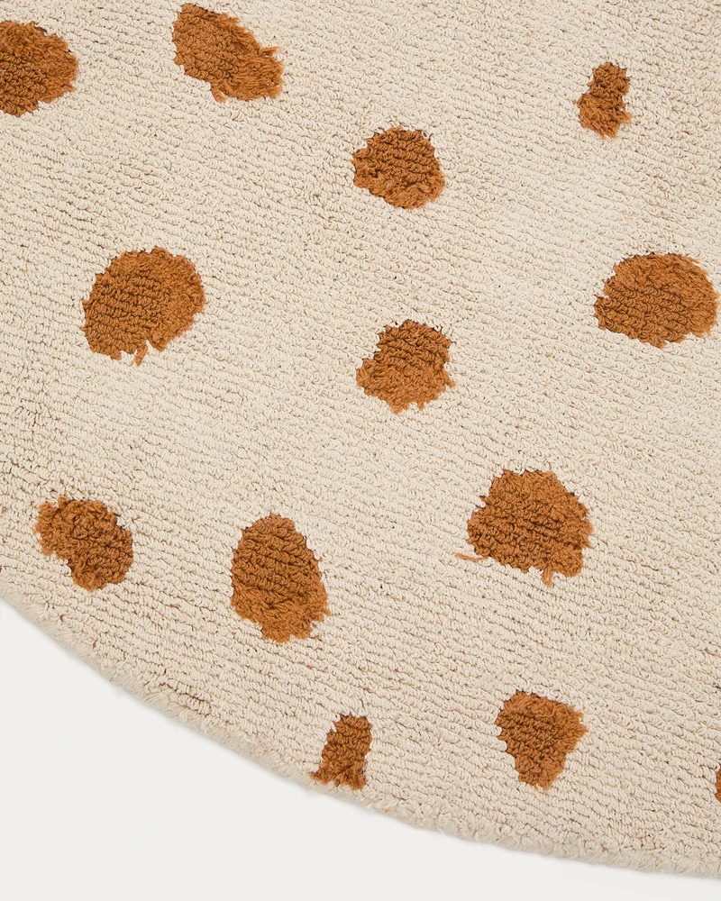 Tandani beige cotton round rug with orange cheetah design Ø 100cm