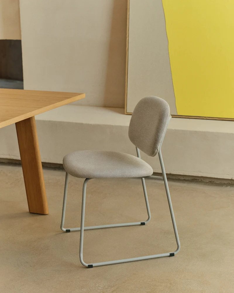 Meli stackable chair in beige chenille with beige metal legs