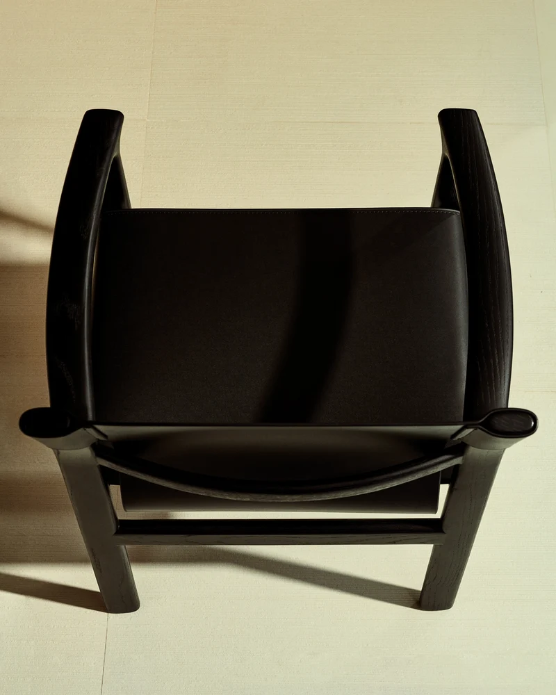 Jan chair made of black recycled leather fibres and FSC 100% solid ash wood with black finish