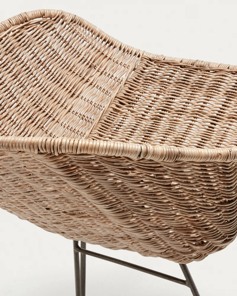Chart chair made from rattan with black finished steel legs