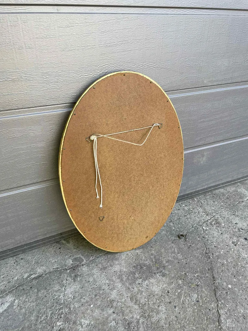 Miroir ovale doré