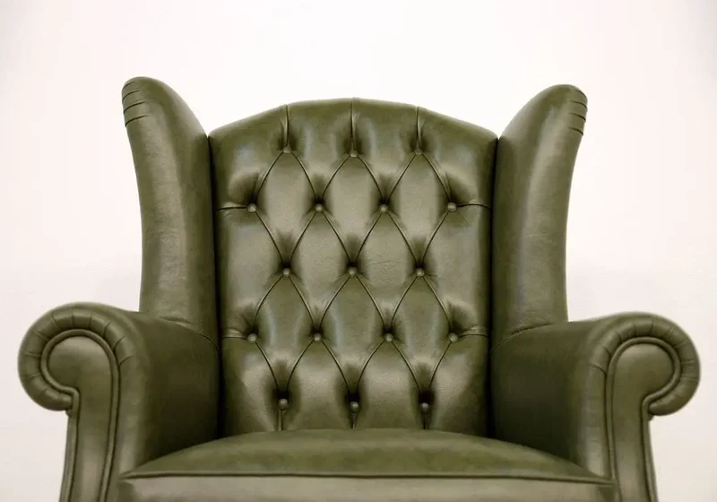 Fauteuil bergère vintage en cuir vert - Chesterfield